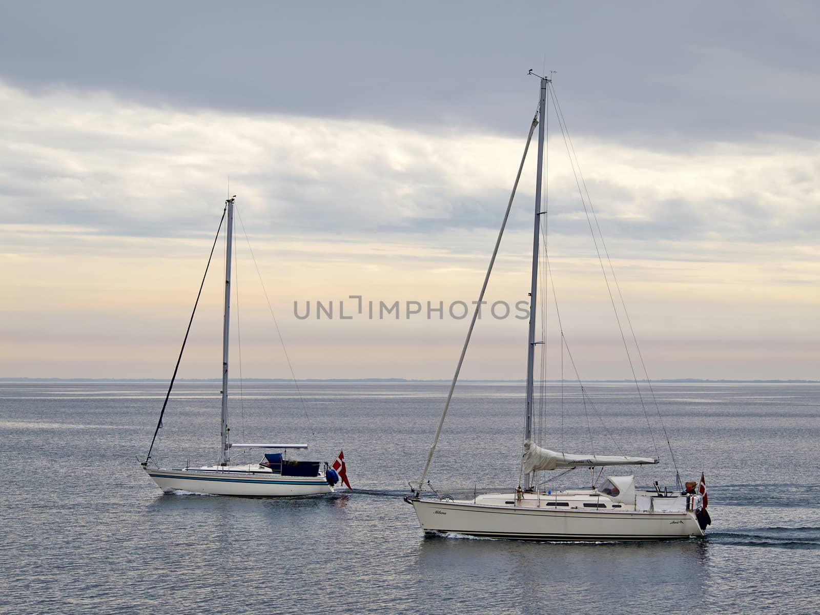 Sailing yacht boat sailing on the ocean sea with beautiful calm water  