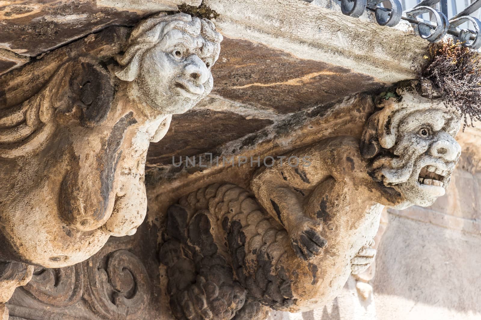 The detail of a baroque balcony in sicily