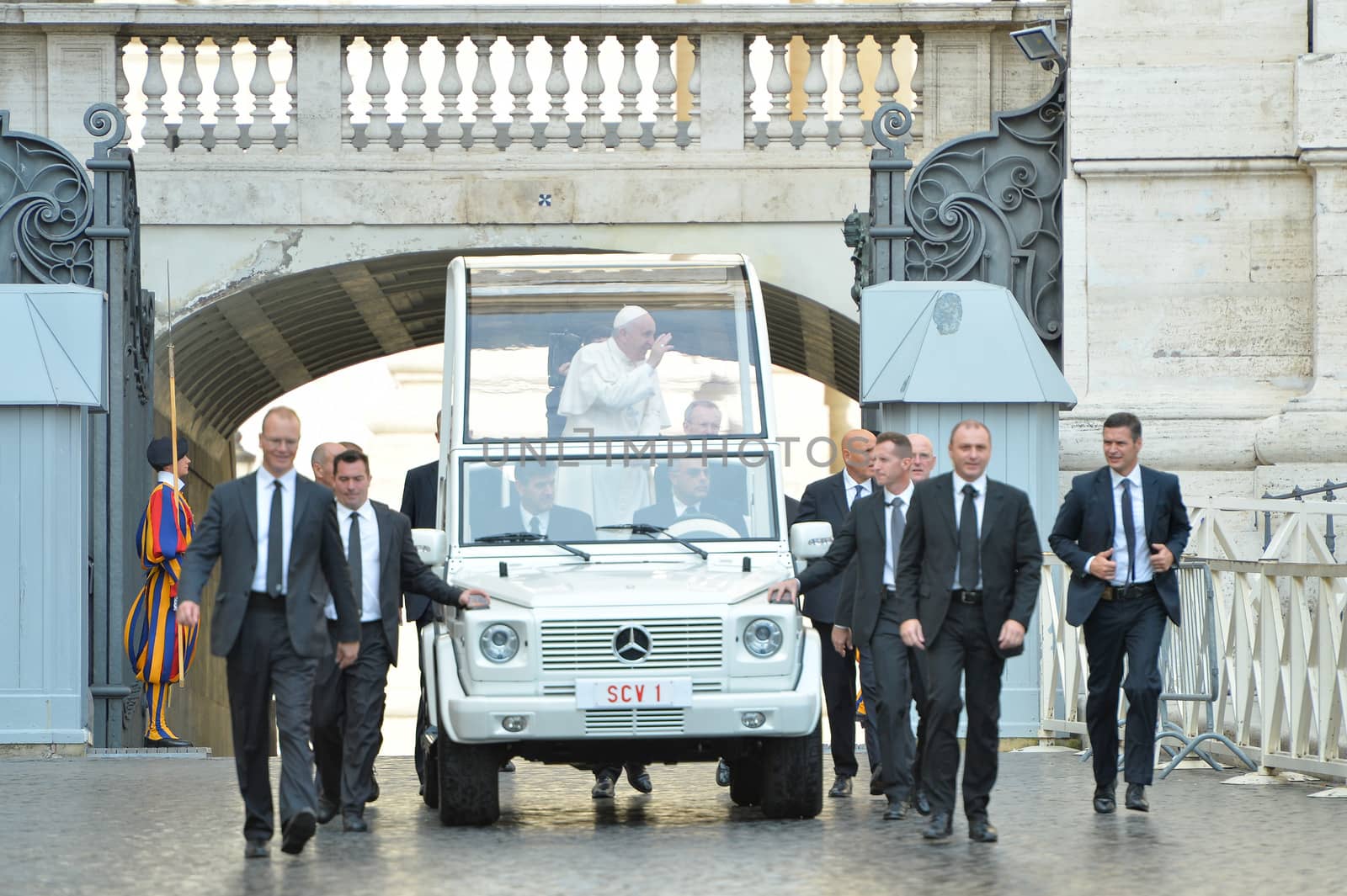 ITALY, Rome: Pope Francis waves to a crowd in St. Peter's Square at the Vatican on October 14, 2015. While addressing his weekly general audience there, the pope reportedly asks forgiveness for a pair of scandals within the Vatican this month: Monsignor Krzysztof Charamsa was recently dismissed after revealing at an October 3 news conference that he was gay and had lived with his male partner for years. And a clergyman at the Santa Teresa d'Avila parish reportedly had relations with vulnerable adults, according to local media.