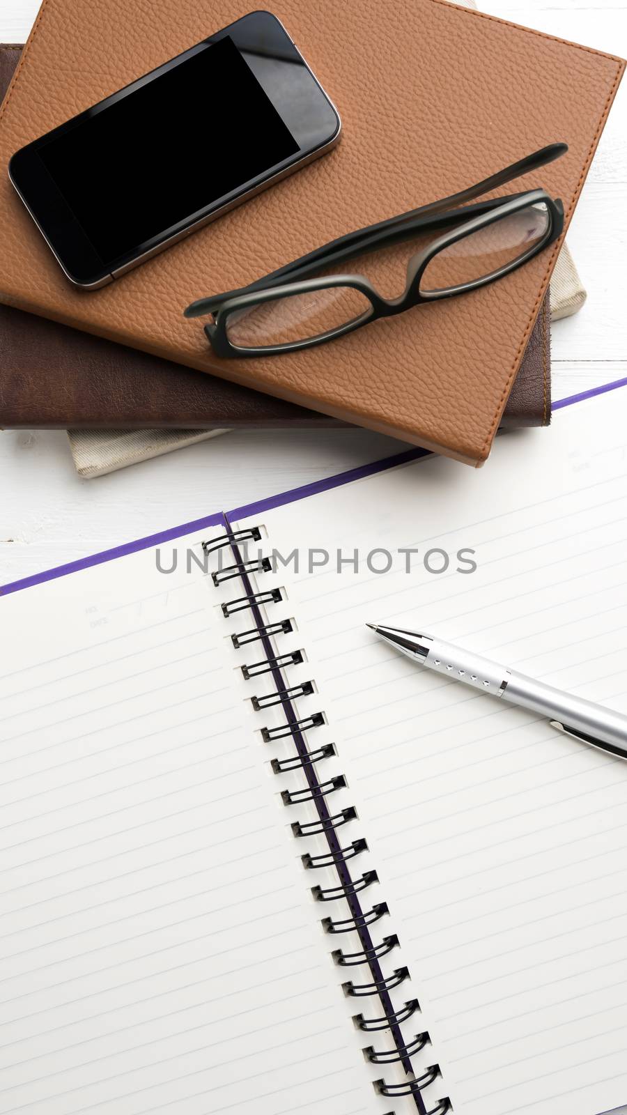 notepad with stack of book by ammza12