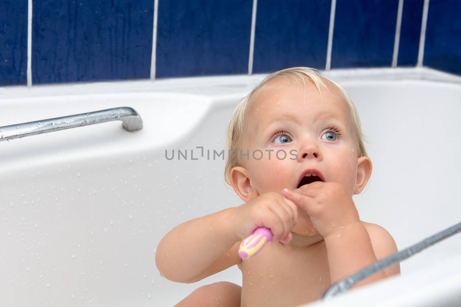 Little girl brusing teeth by kamsta