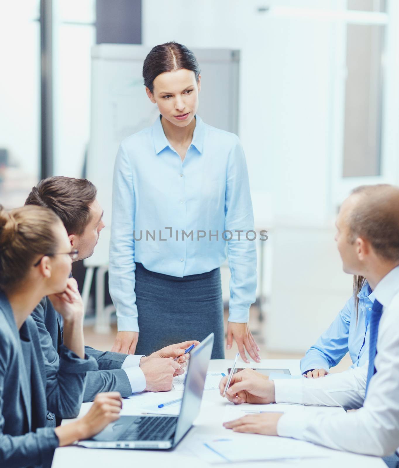 strict female boss talking to business team by dolgachov