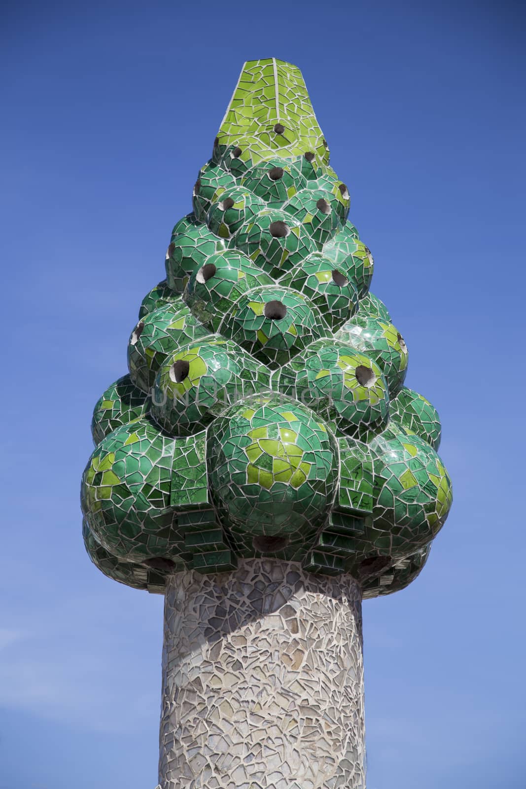 Barcelona, Spain - September 25, 2015: Gaudi Chimney, Palau Guell, Gaudi broken tile mosacis and strange decorated chimneys are evident in his early work at Palau Guell.
