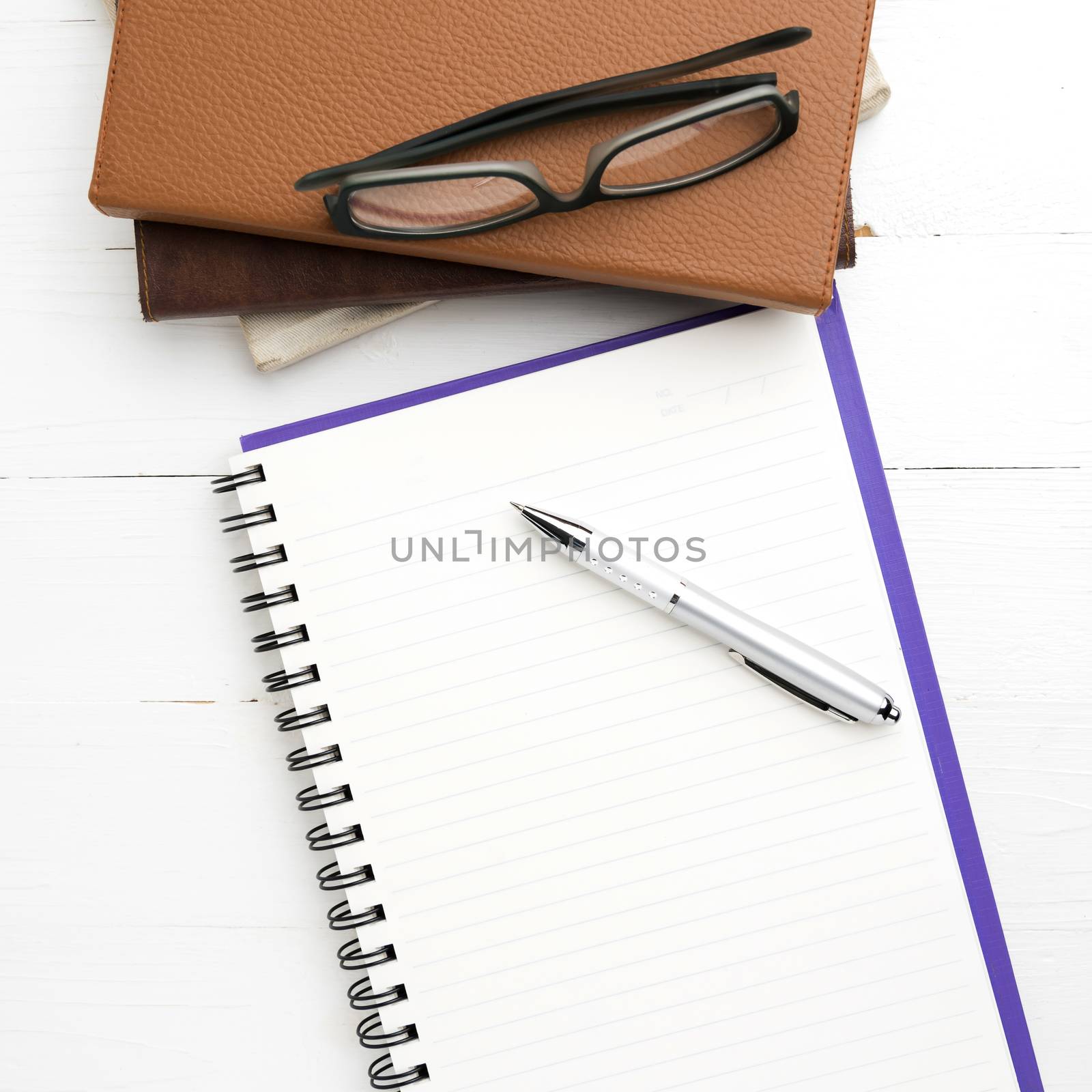 notepad with stack of book by ammza12