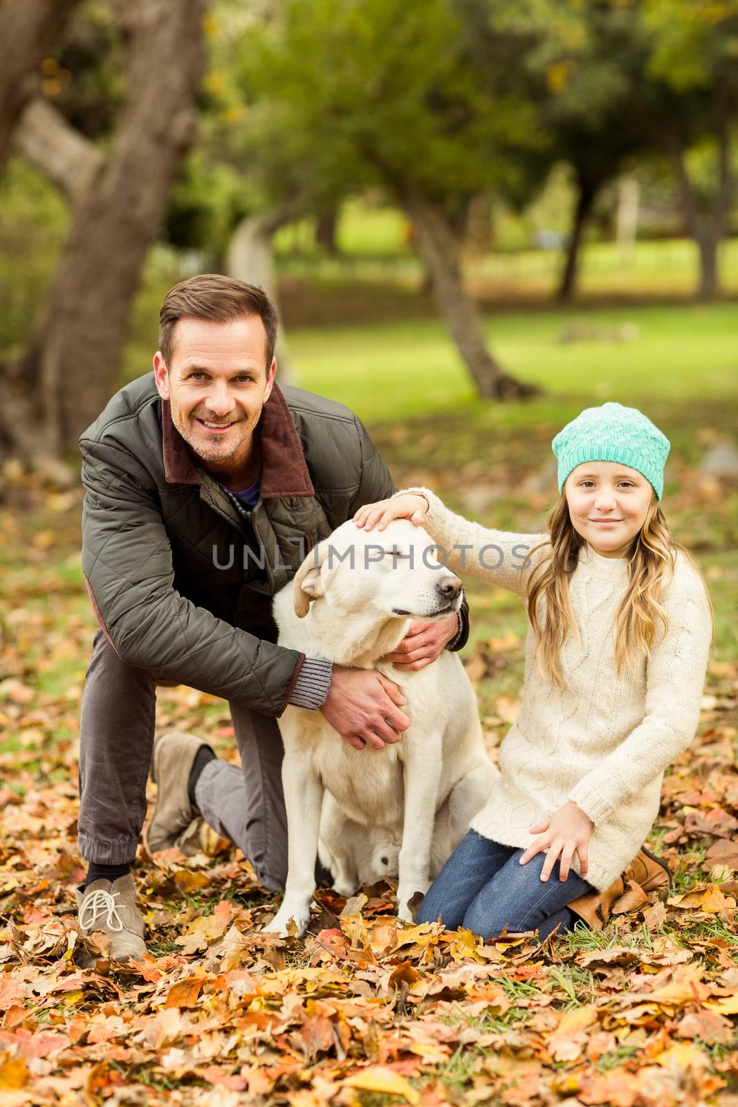 Young family with a dog by Wavebreakmedia