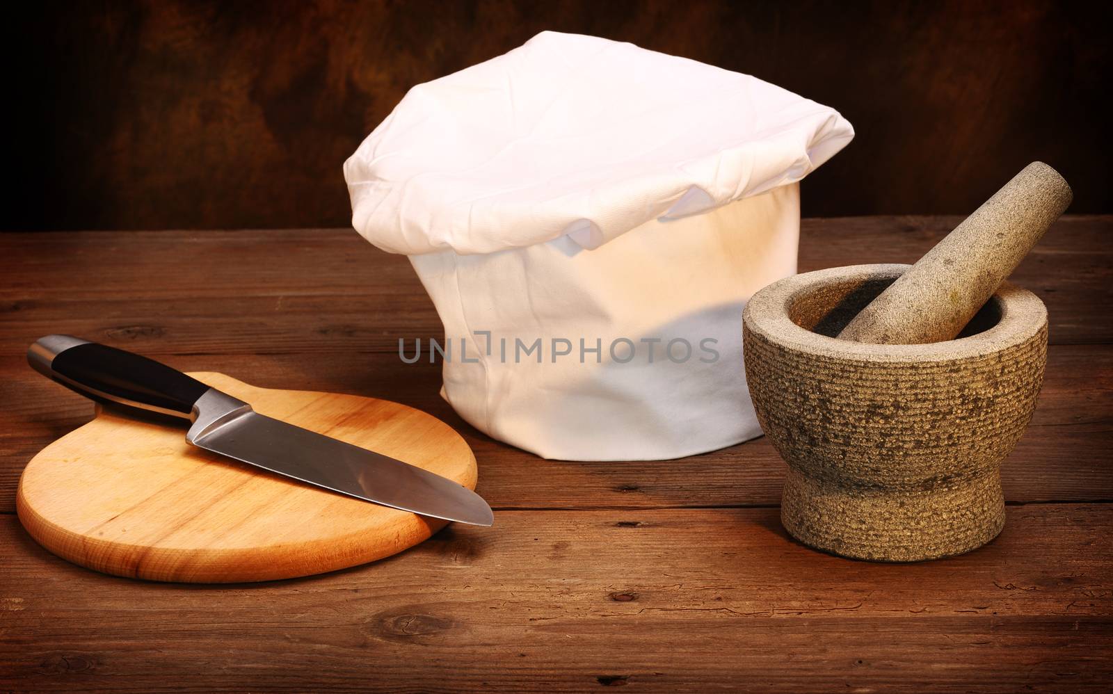 chef's hat, mortar and cooking knife 
