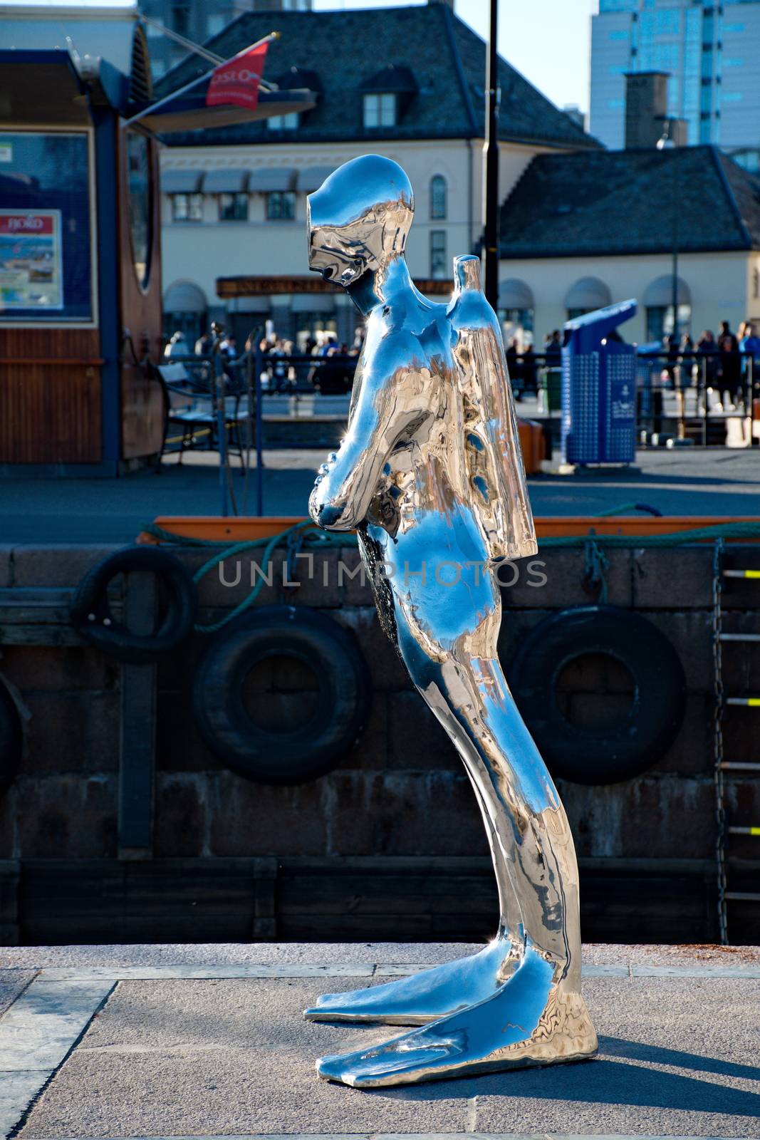OSLO - MARCH 21: Contemporary scuplture of a diverr in Oslo harbour created by sculptor Ola Enstad