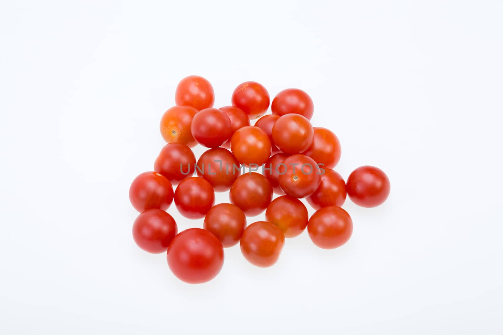 Fresh ripe cherry tomatoes isolated on a white background 