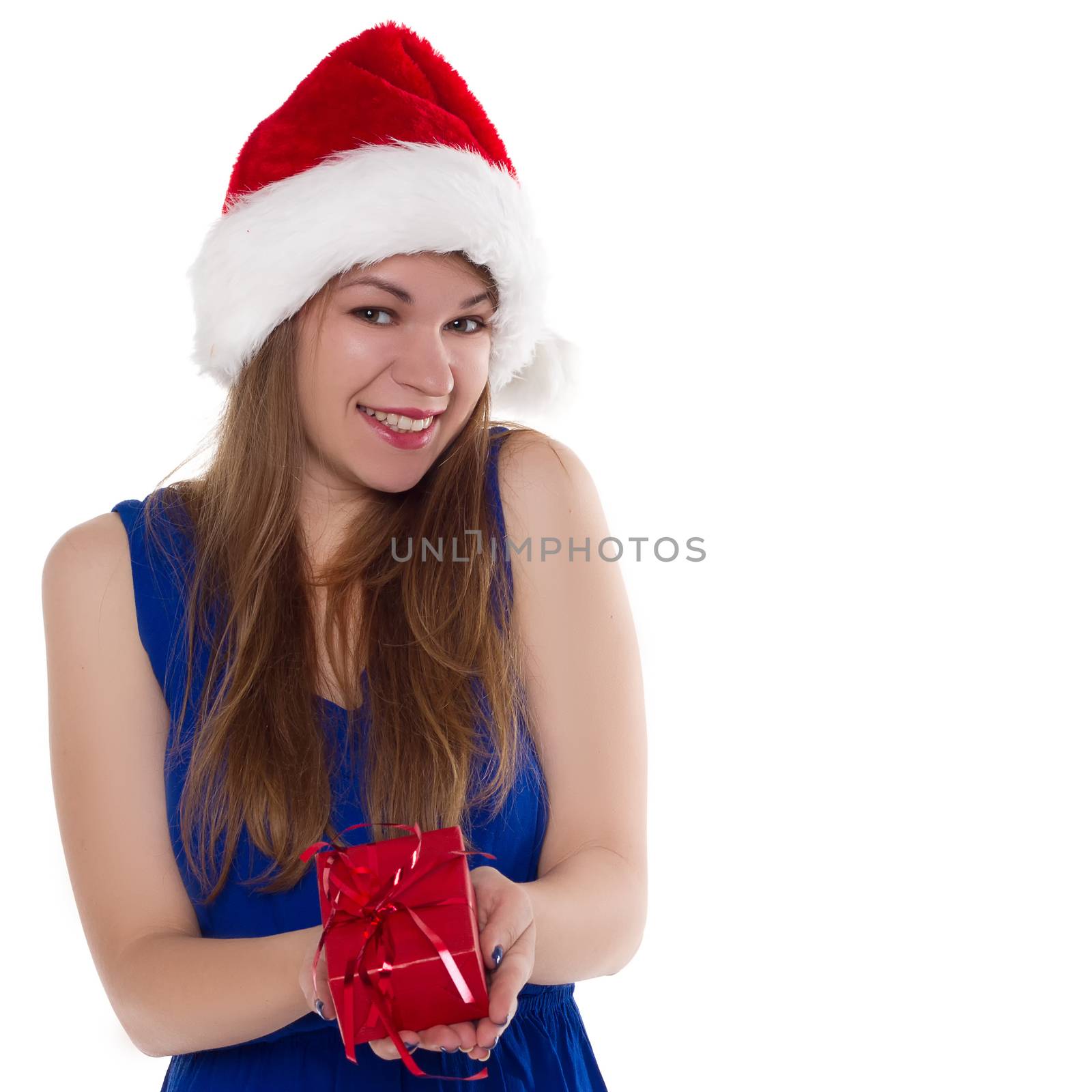 girl in a Christmas cap gift to rejoice on white background.