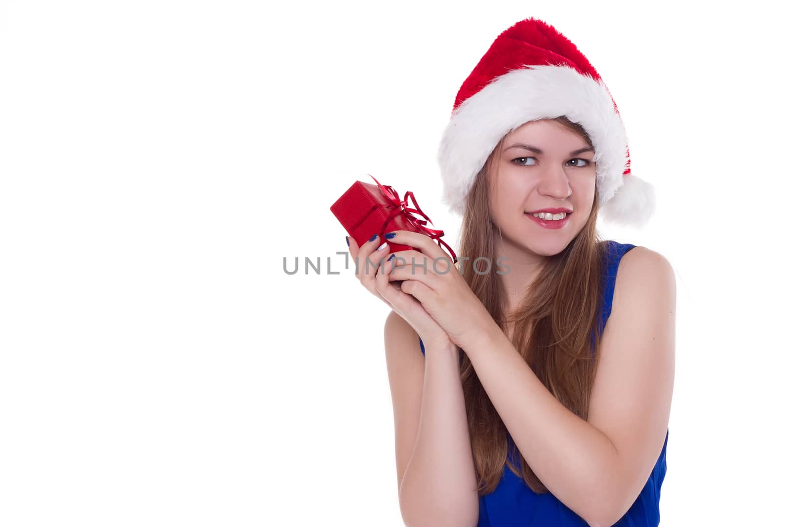 girl in a Christmas cap gift to rejoice on white background.