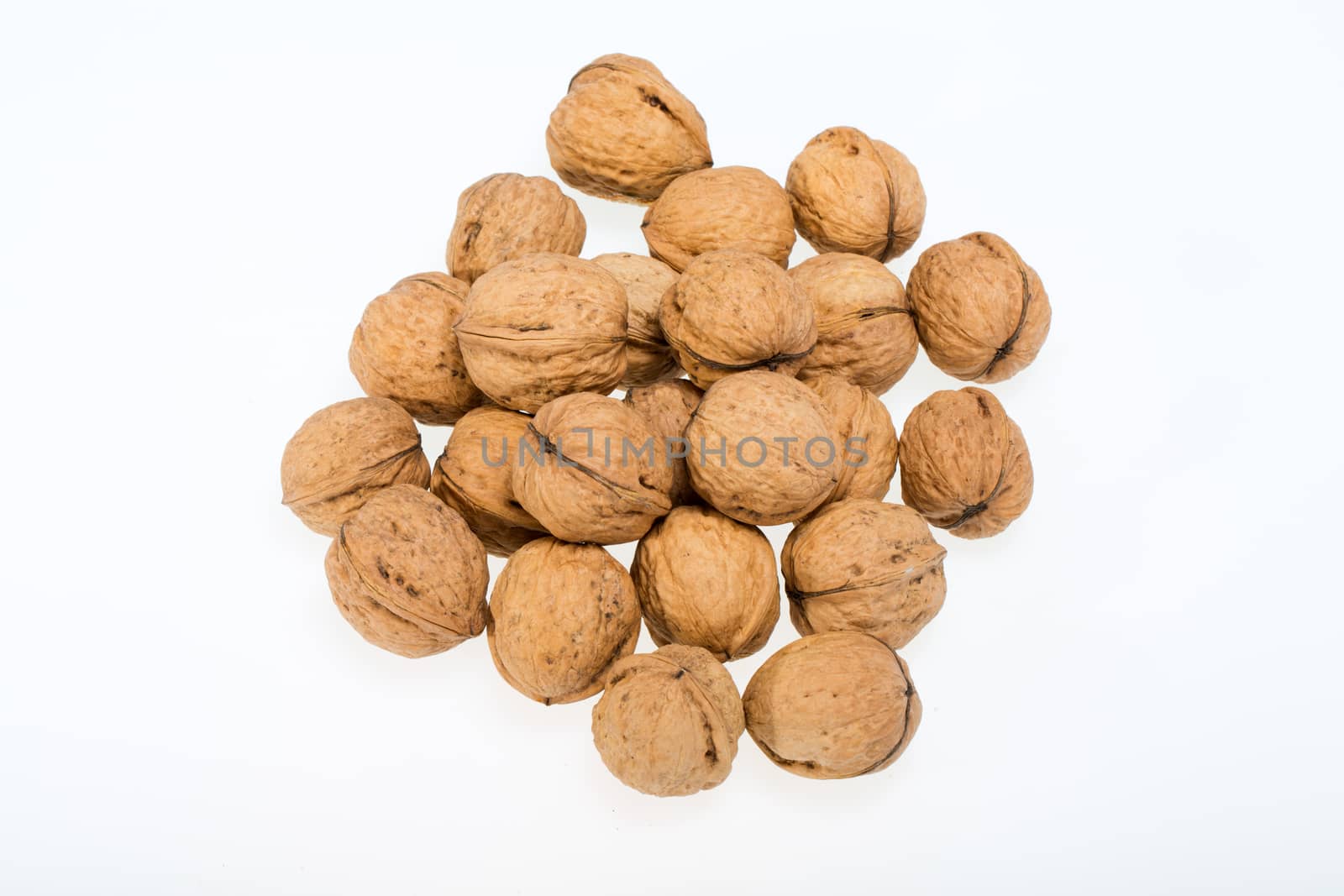 walnuts heap isolated on  white background  by wjarek