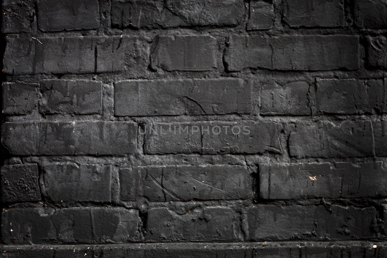 Black brick wall by ints