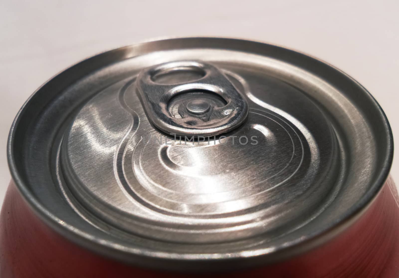 a close up of a soda can lid showing shallow depth of field