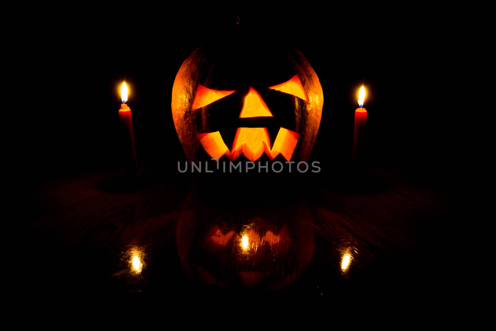 The photograph shows a pumpkin on Halloween