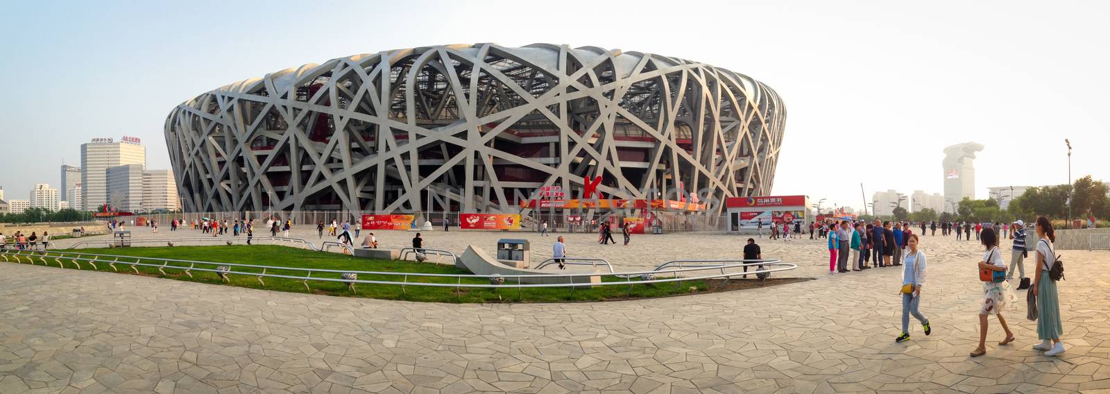 BEIJING, CHINA - SEPTEMBER 21, 2015: Tourists walking around the Bird Nets - China Natinal Olympic Stadium in Beijing, China, September 21, 2015
