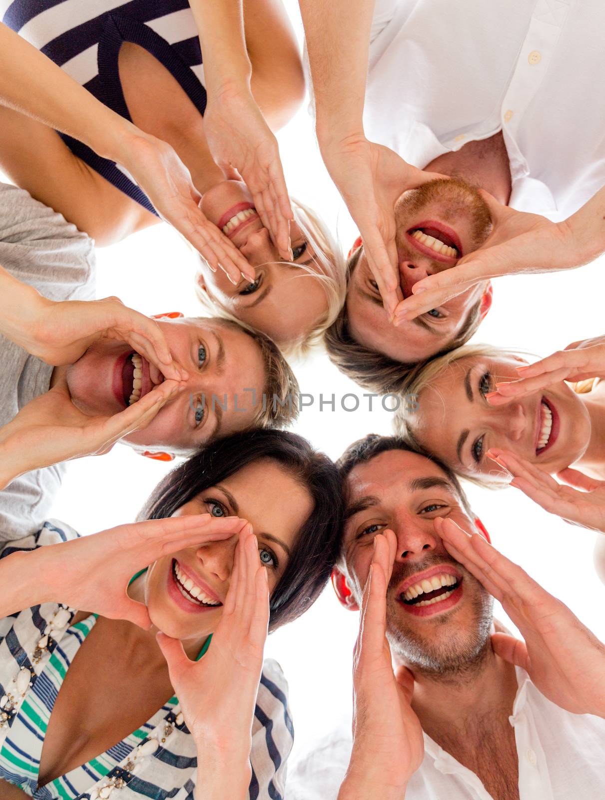 friendship, happiness and people concept - smiling friends in circle