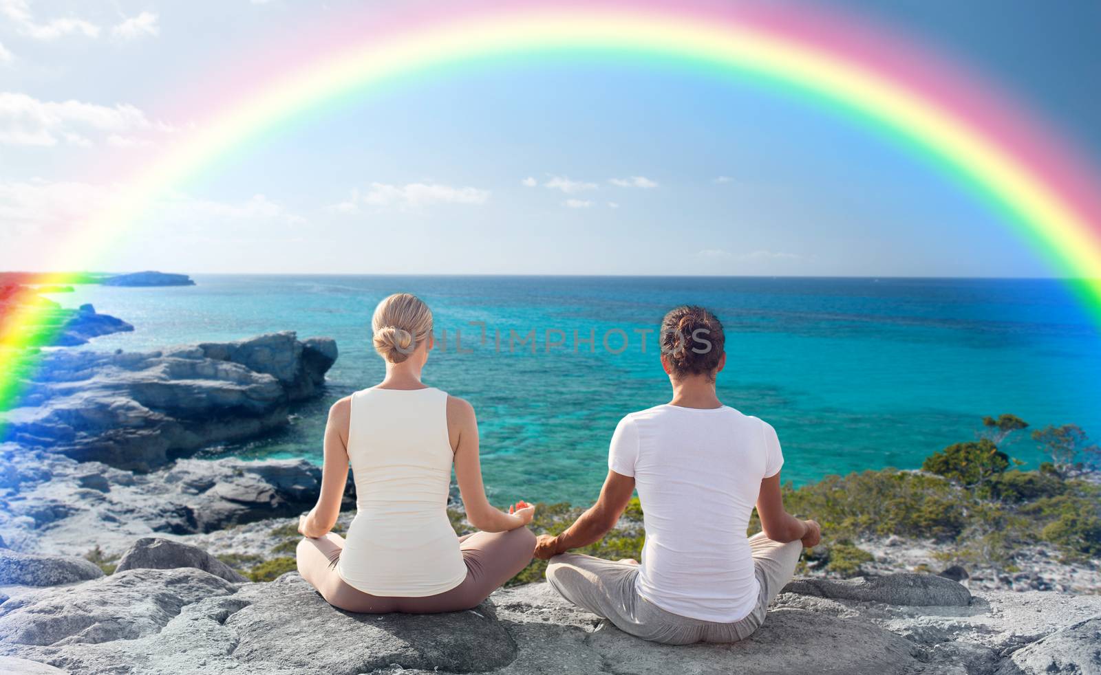 fitness, sport, people, yoga and lifestyle concept - happy couple meditating in lotus pose on summer beach from back