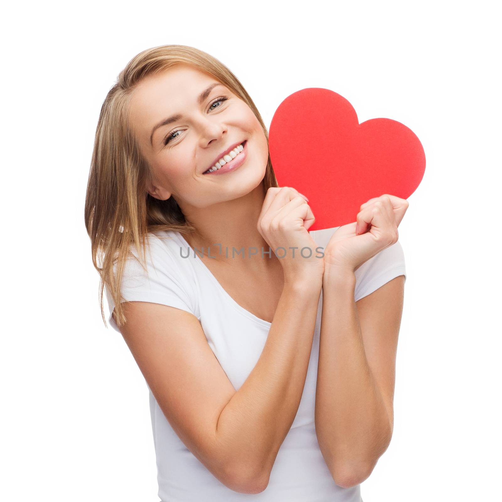 happiness, health and love concept - smiling woman in white t-shirt with heart