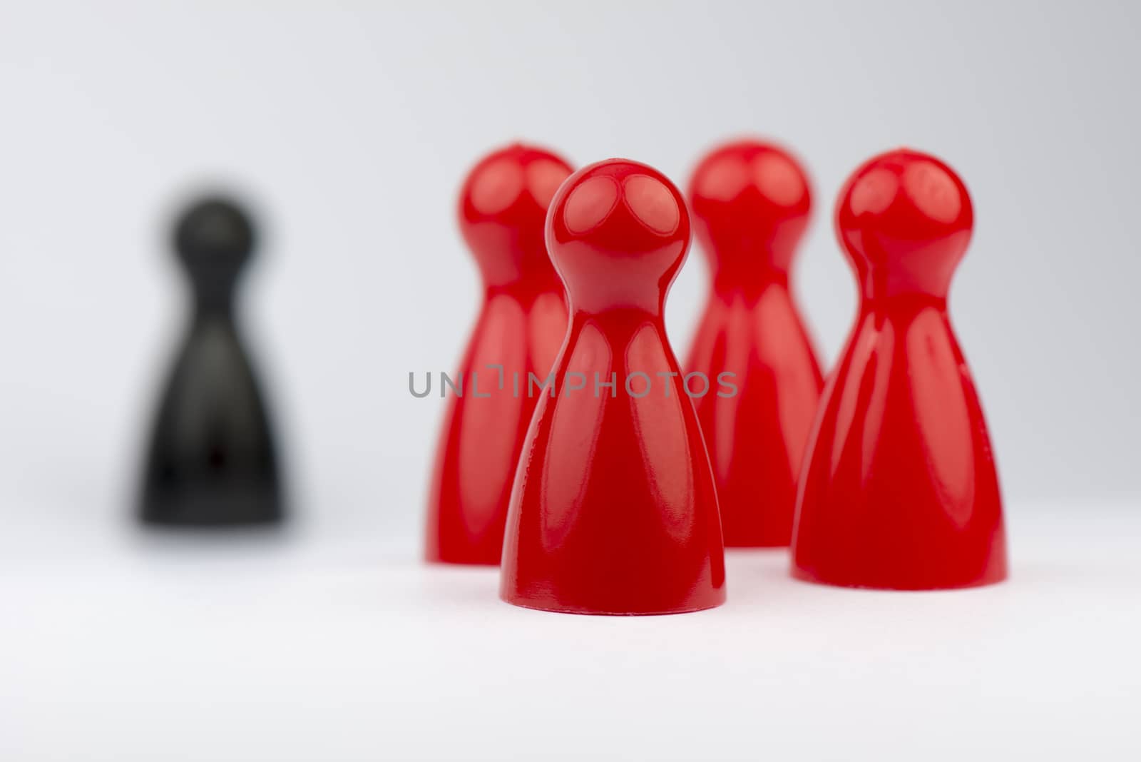 Conceptual game pawns that depict the concept different
