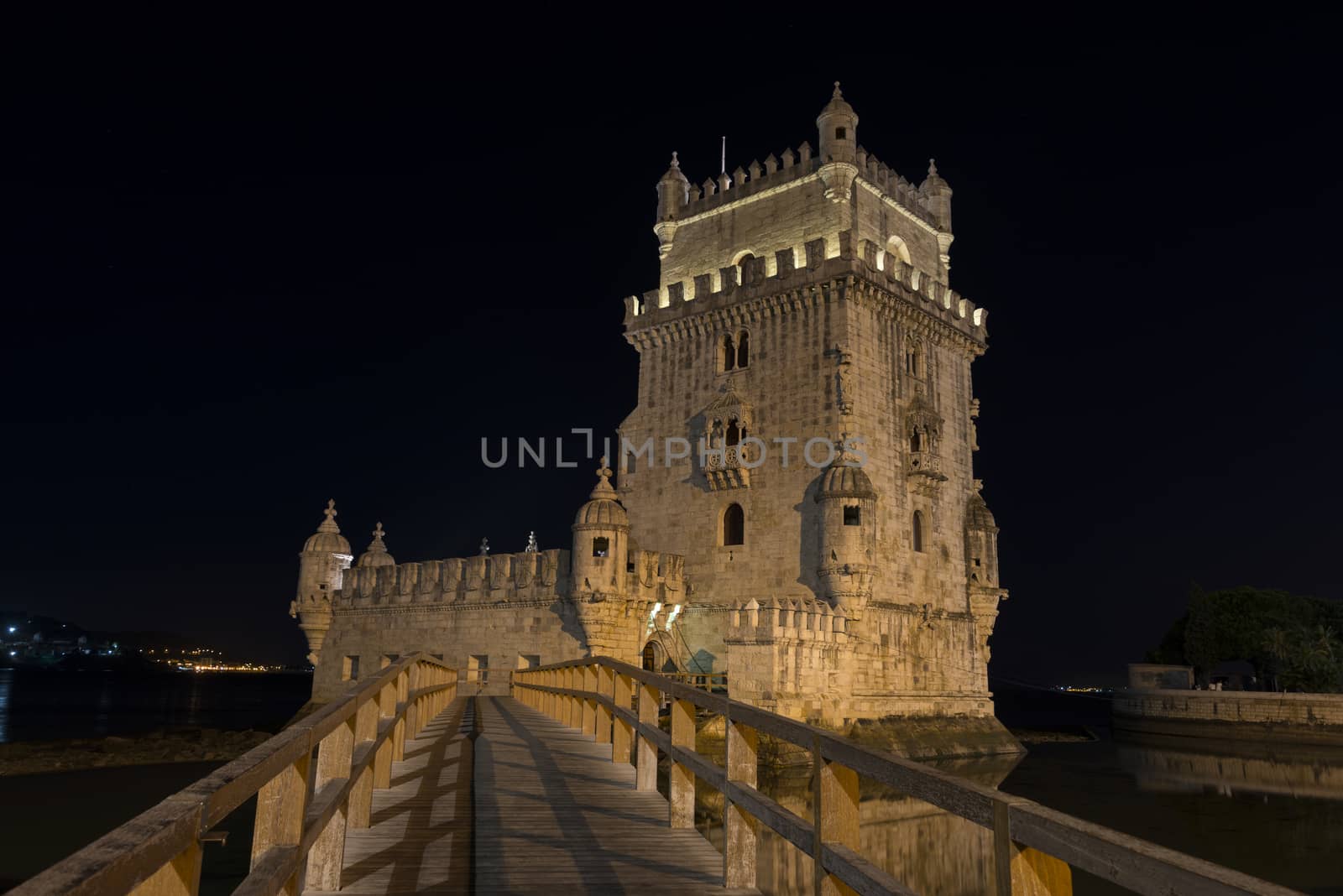 Lisbon, Portugal at Belem Tower on the Tagus River by night