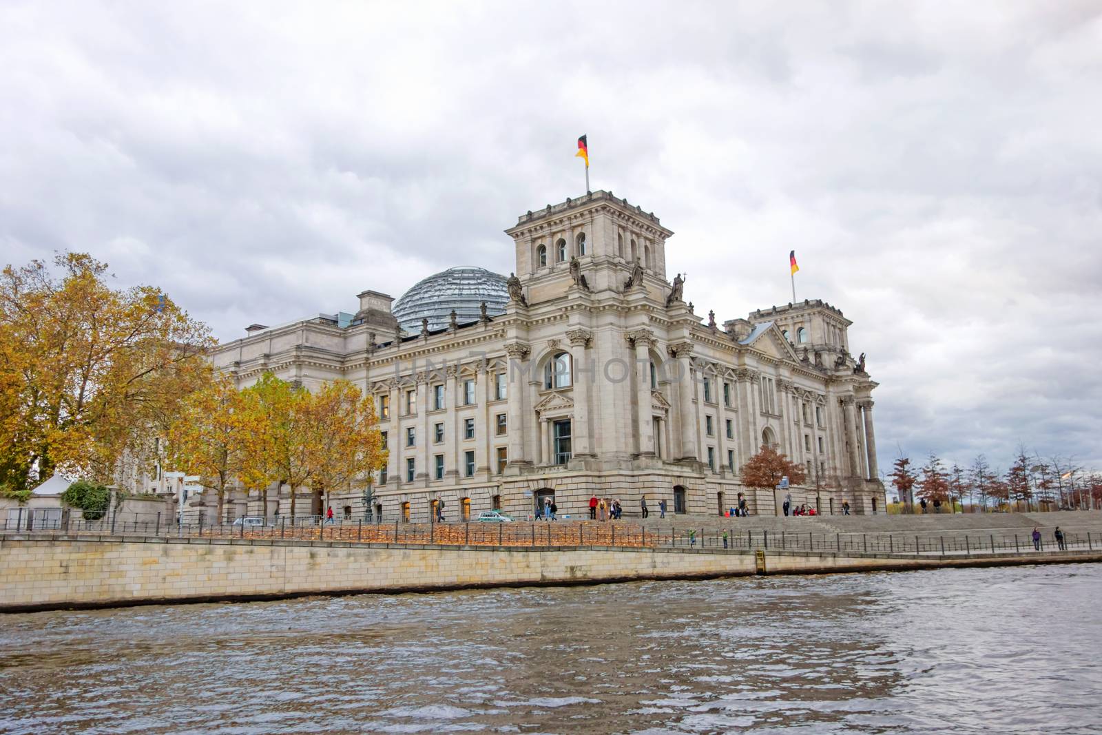 Reichstag in Berlin, Germany - view from river Spree, riverside