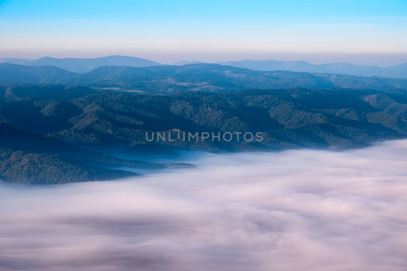 Autumn landscape view of mountain hills above misty clouds, Slov by martinm303