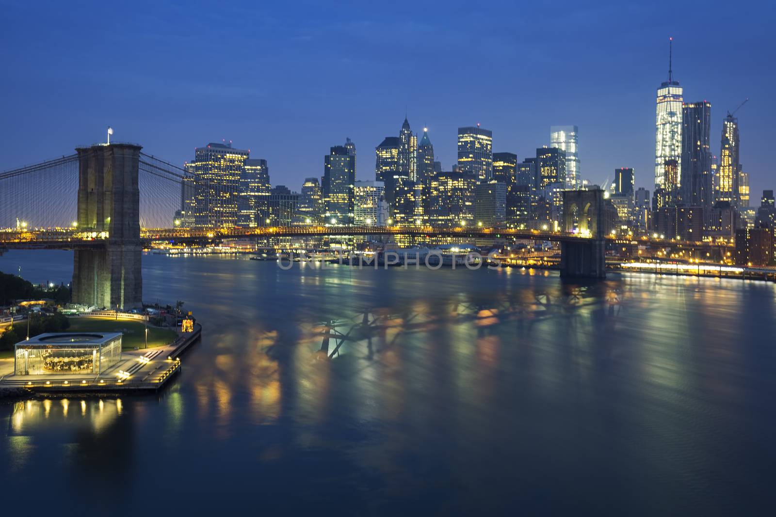 New York City at dusk with Brooklyn Bridge. by vwalakte