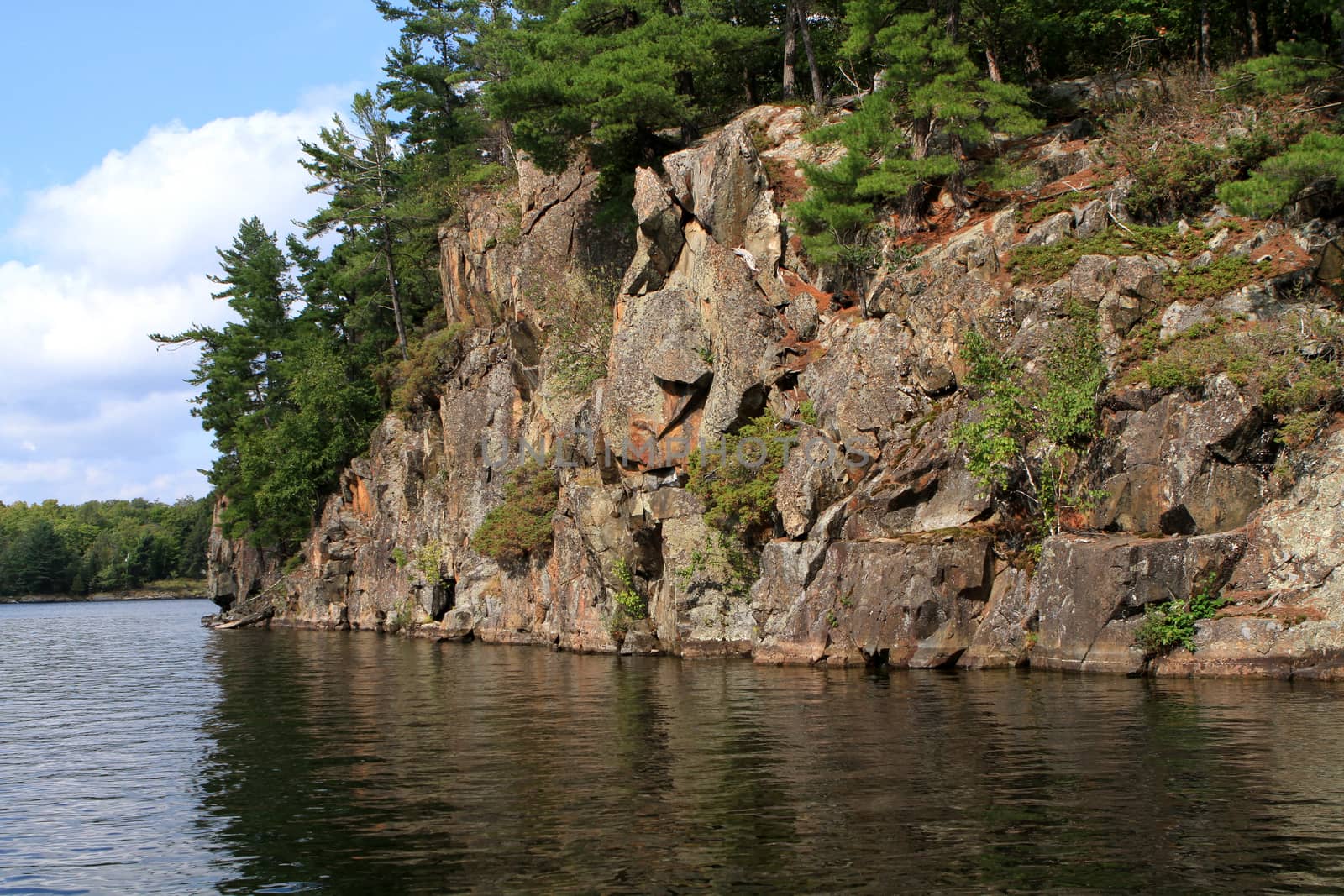 Northern rock wall shoreline late summer afternoon light