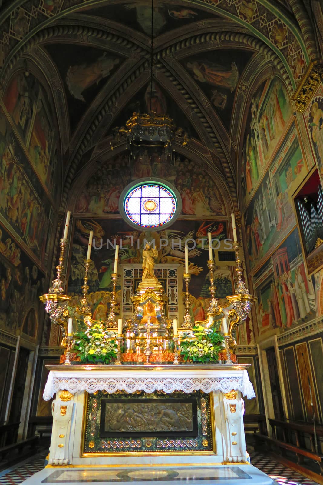 Prato,Italy,11 october 2015. The Chapel of the Sacred Belt is the most sacred place of the entire city of Prato, preserves the Holy Girdle, namely the belt which, according to ancient traditions, was donated by the Virgin to St. Thomas during the Assumption, and arrived in Prato in the XII century.The chapel is frescoed with stories of the Virgin and the Girdle was painted in 1392-1395 by Agnolo Gaddi with perfect technique and bright colors.The elegant eighteenth-century altar, with relief by Emilio Greco, contains the Sacred Belt, and is crowned by a marble Madonna and Child (about 1301), a masterpiece by Giovanni Pisano.