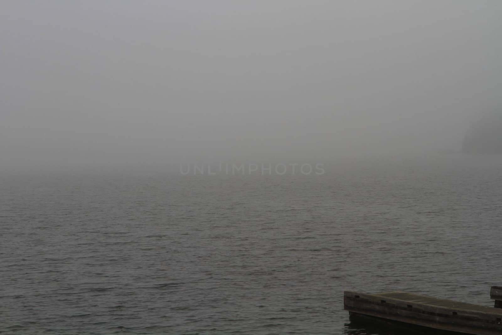 Morning mist on northern lake late summer