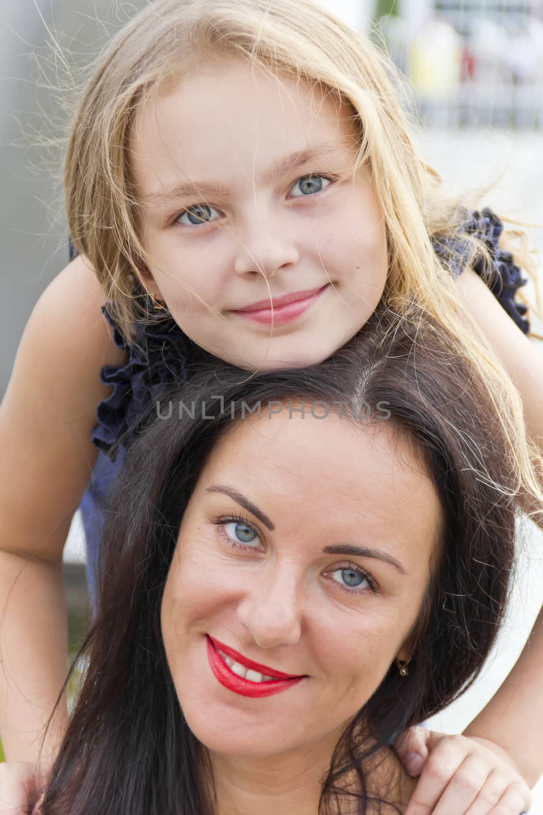 Portrait smiling mother and daughter in summer