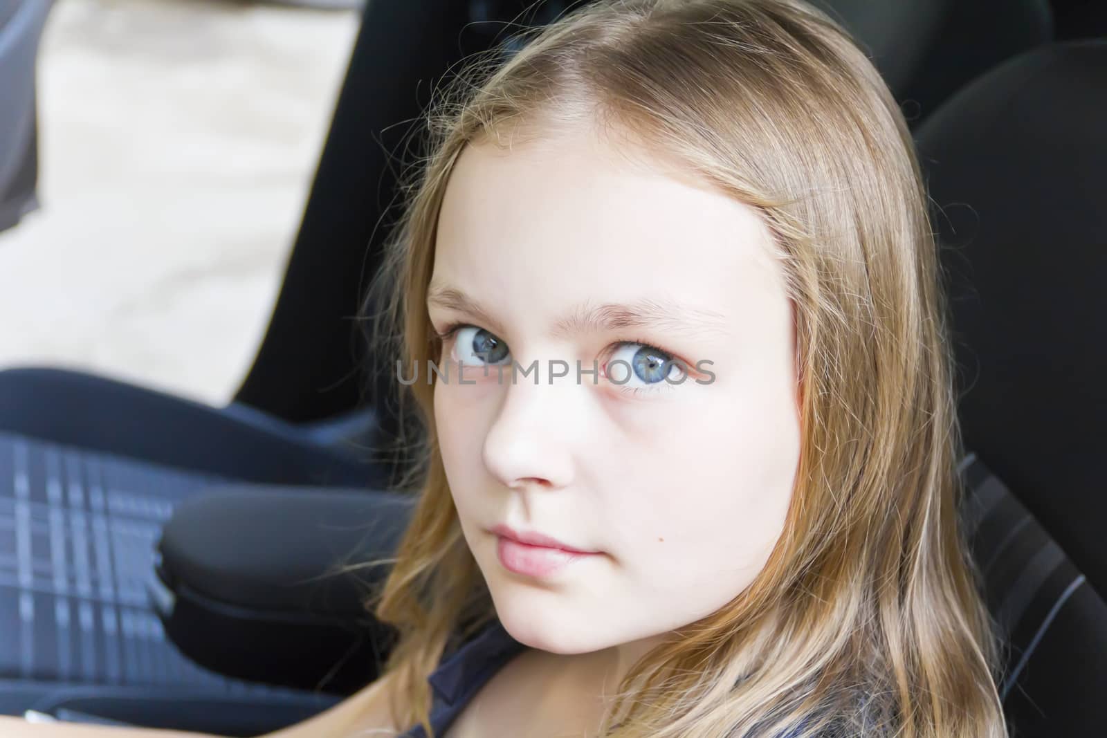 Portrait of cute girl with blond hair