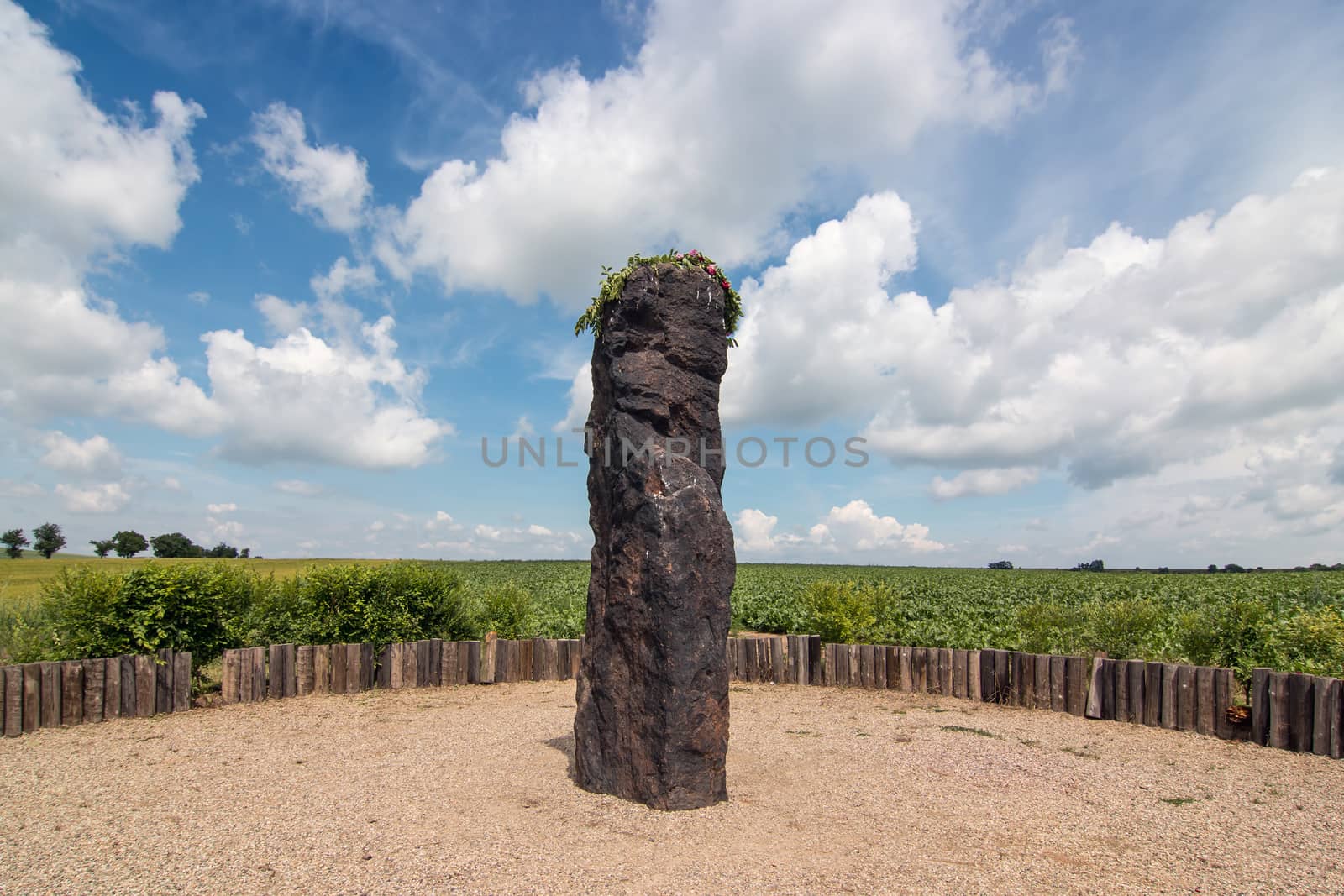 Menhir Stone Shepherd (also Stone Man, Petrified Man or Petrified minister) is a menhir standing alone in a field 1 km northwest of the village Klobuky, district Kladno. This is the highest menhir in the Czech Republic.  3.5 m tall columnar rock uncut dark iron Cretaceous sandstone. This is one of the few stones in the country, which we can with high probability be considered a real prehistoric menhir.