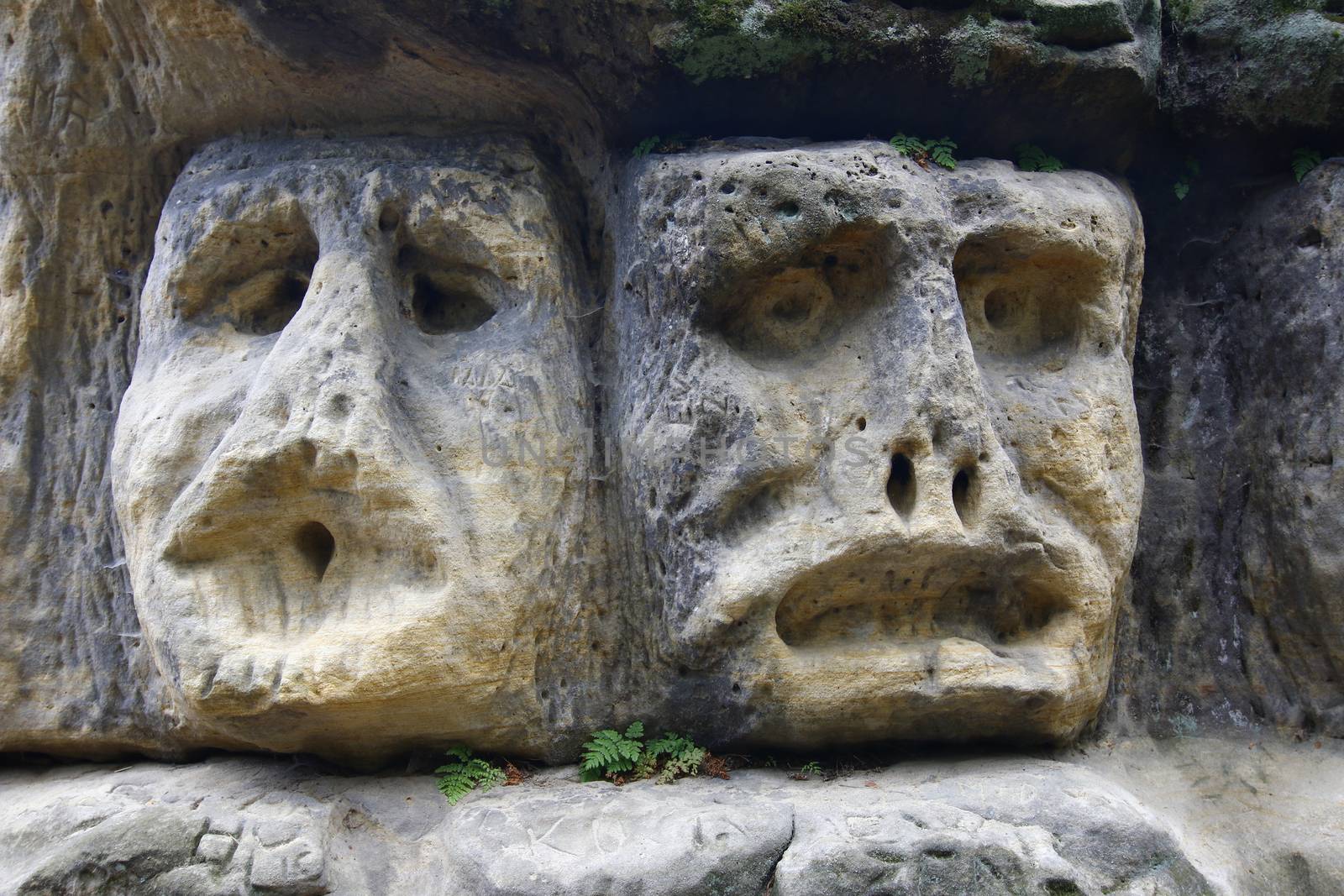 Scary Stone Heads - rock sculptures of giant heads carved into the sandstone cliffs in the pine forest above the village Zelizy in the district Melnik, Czech republic. It is the works of sculptor Vaclav Levy, who created in the period 1841-1846.