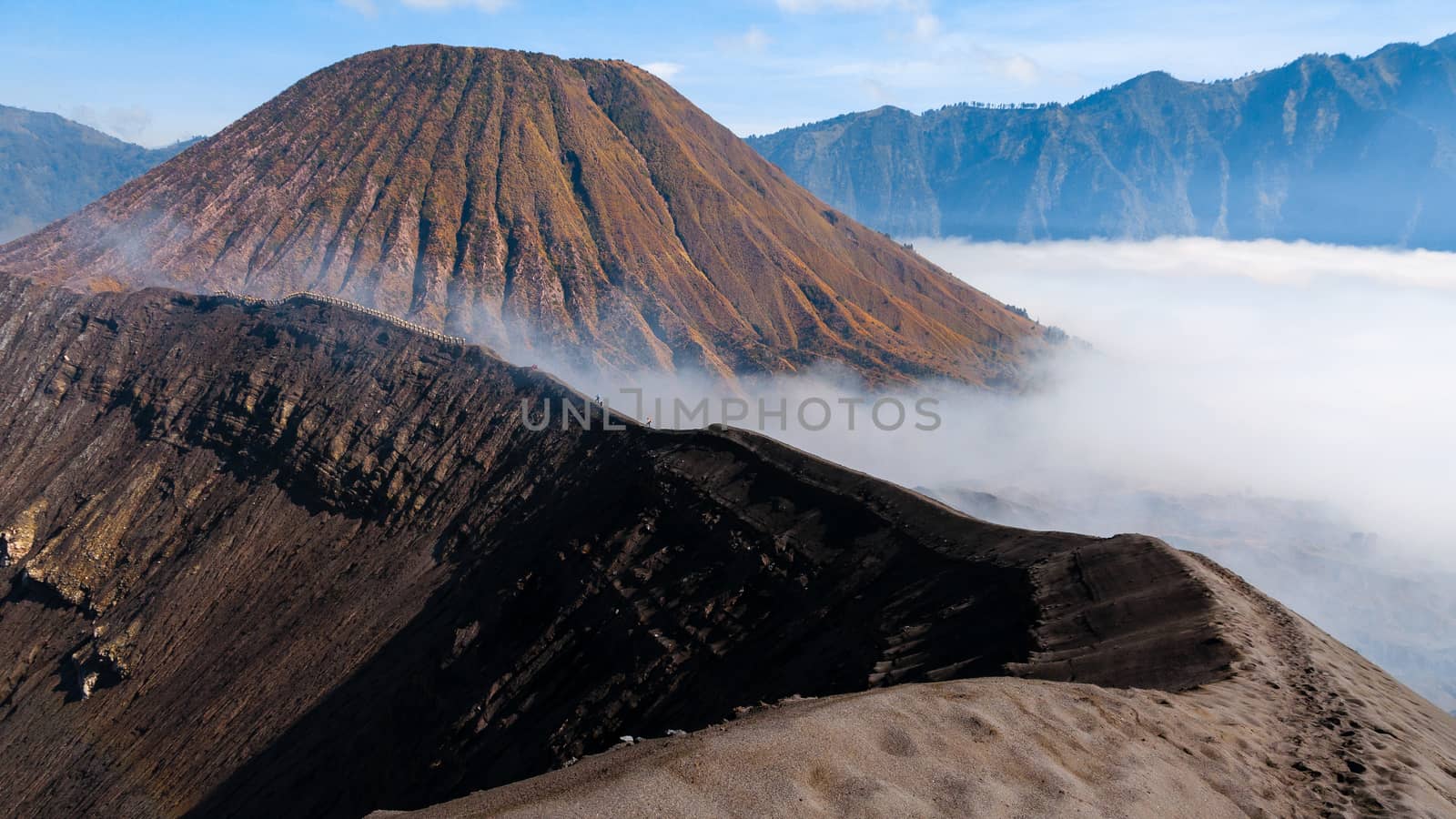 Top of smoking sulfur Volcano Bromo during early sunrise in Java Indonesia