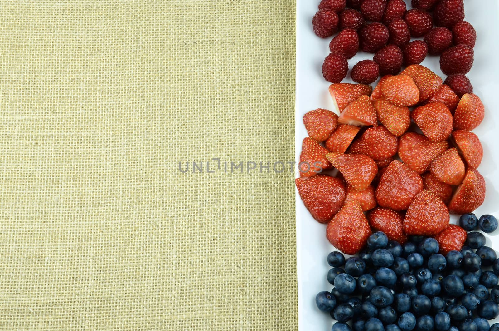 Raspberry, blueberry, strawberry fruits frame ready to add text
