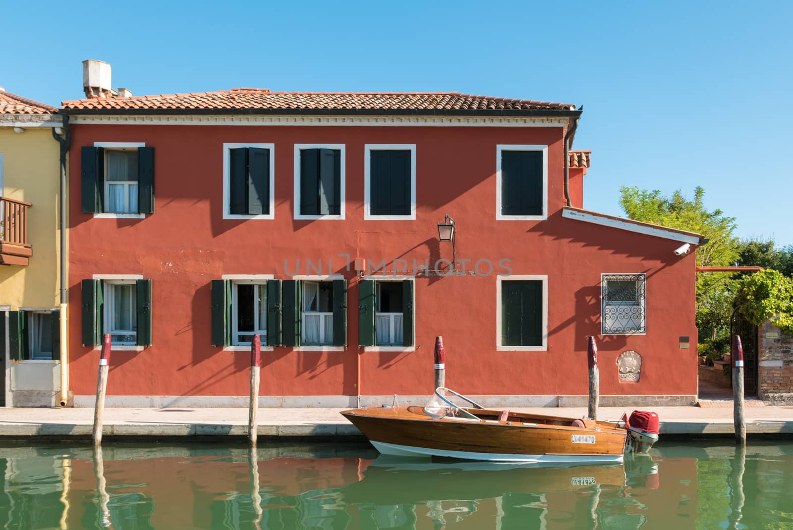 VENICE, ITALY CIRCA SEPTEMBER 2015: Typical Venetian house with boat used for transportation.