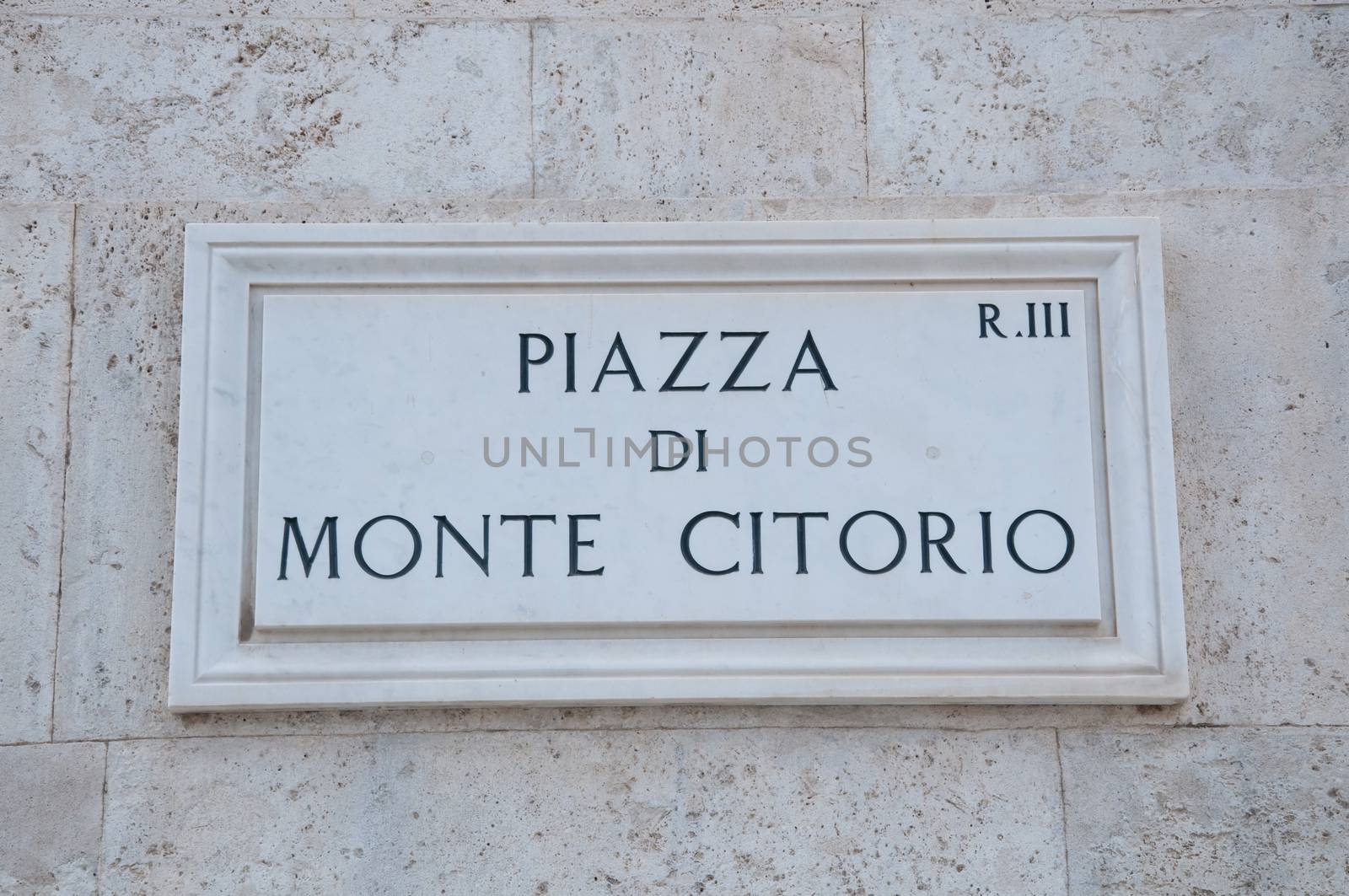 Road sign indicating a street name in Italian "piazza di Montecitorio" in English means Montecitorio square, rome