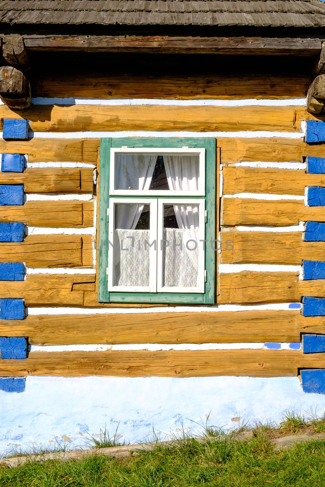 Detail view of old traditional colorful wooden house and window, Stara Lubovna, Slovakia, Eastern Europe