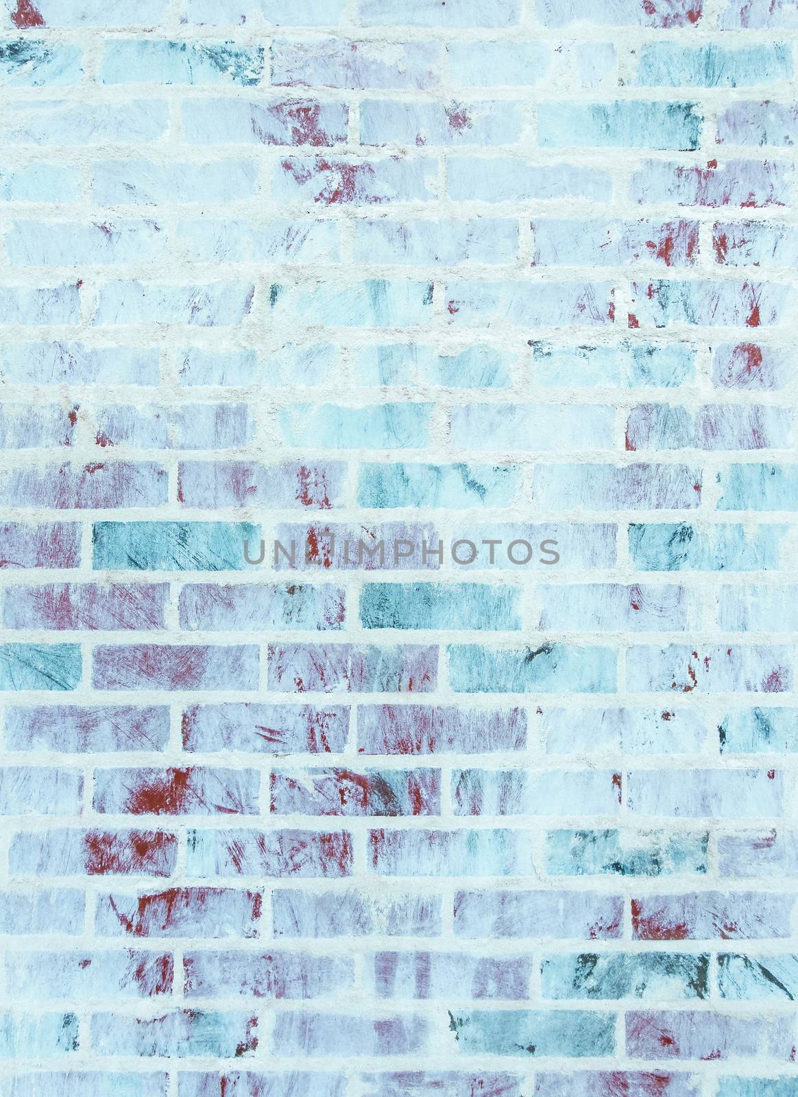 Whitewashed brick wall texture with blue and green hues