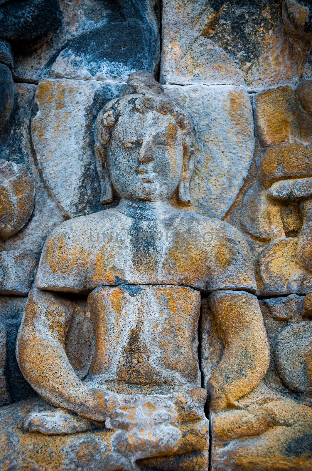 Sitting Buddha encarved in stone, found at Borobudur Indonesia, biggest buddhist temple in 