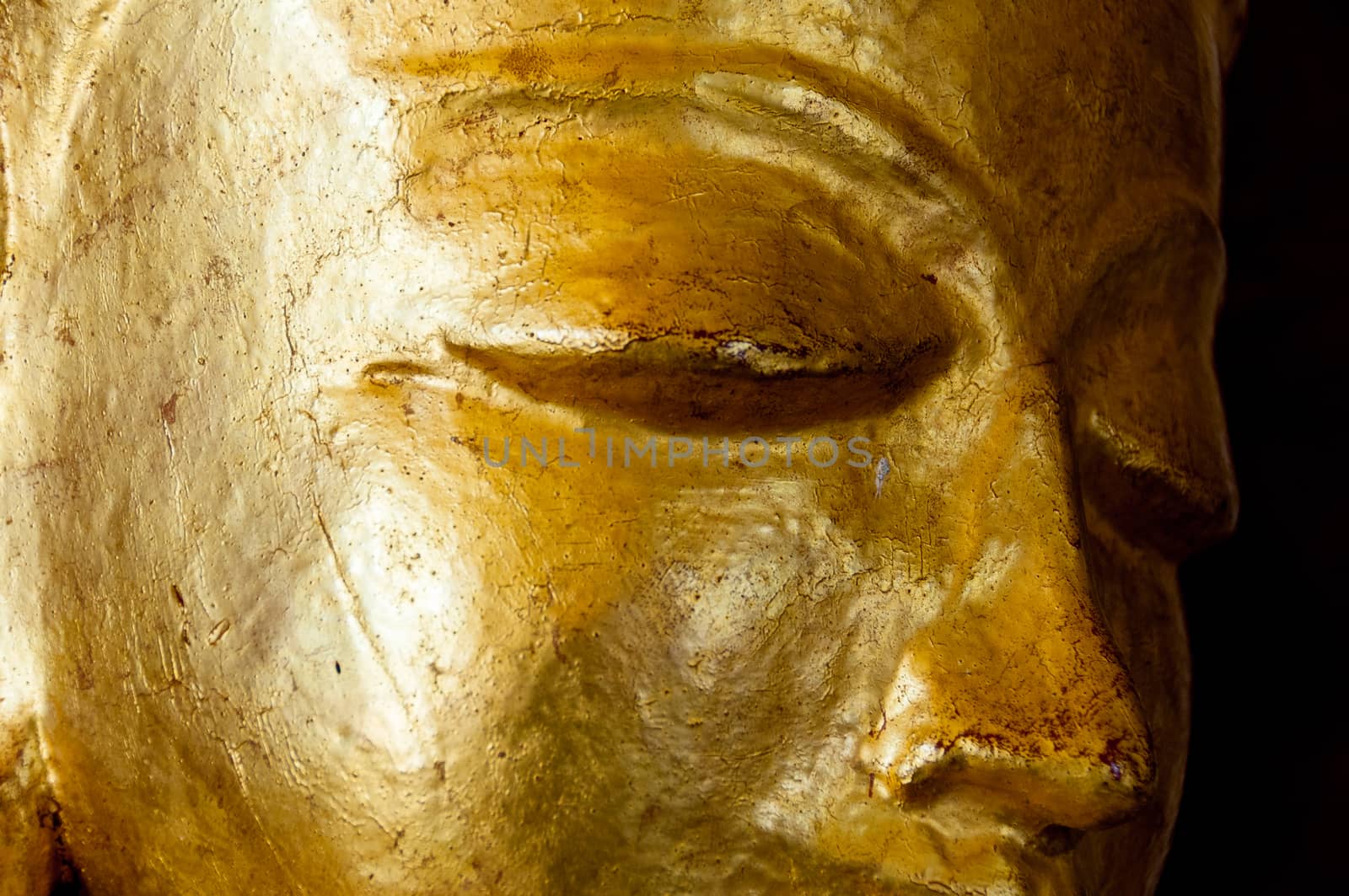 Buddha face gold statue close-up in temple bagan myanmar
