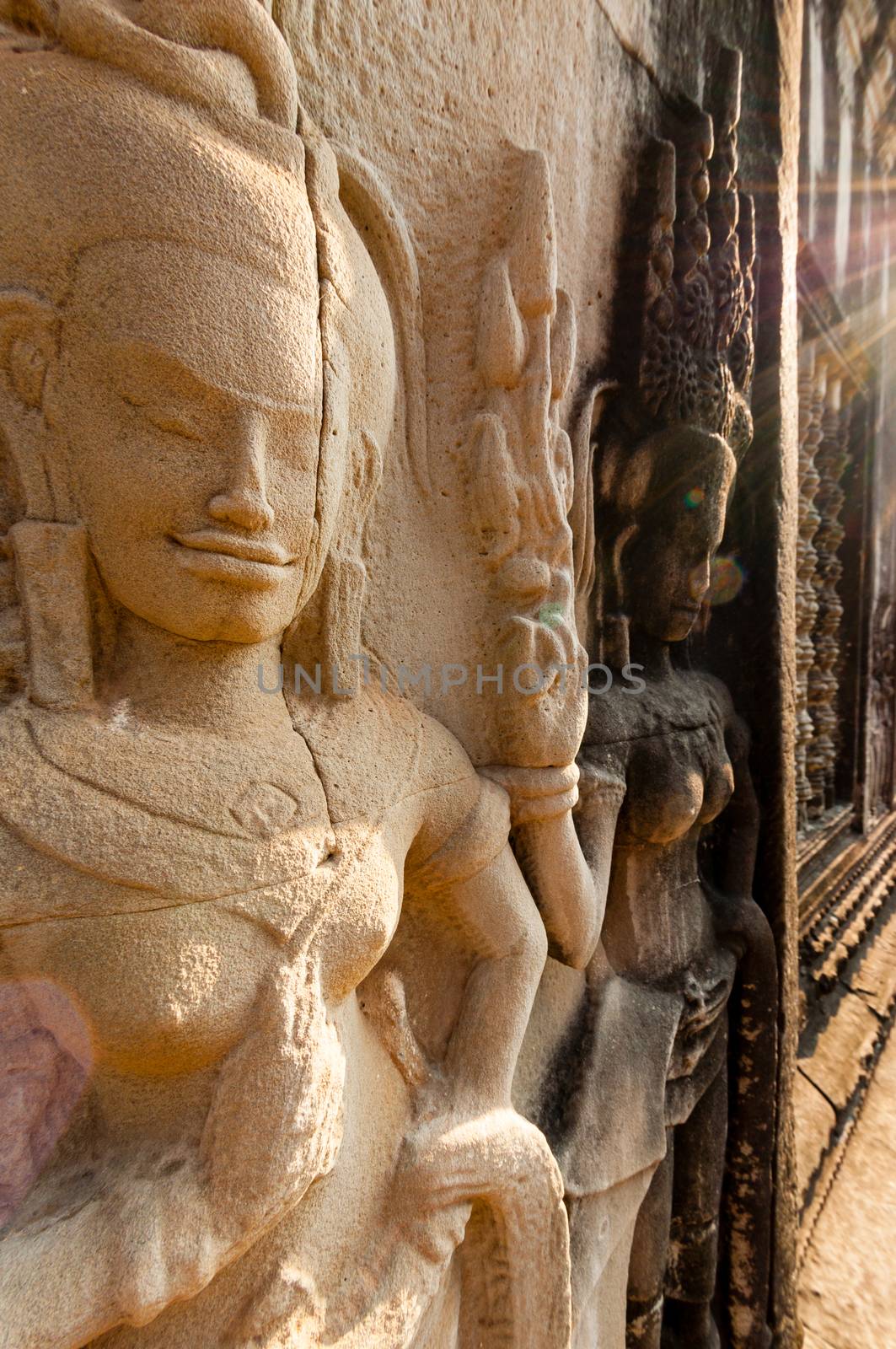 Detail of stone encarving Apsara at angkor wat