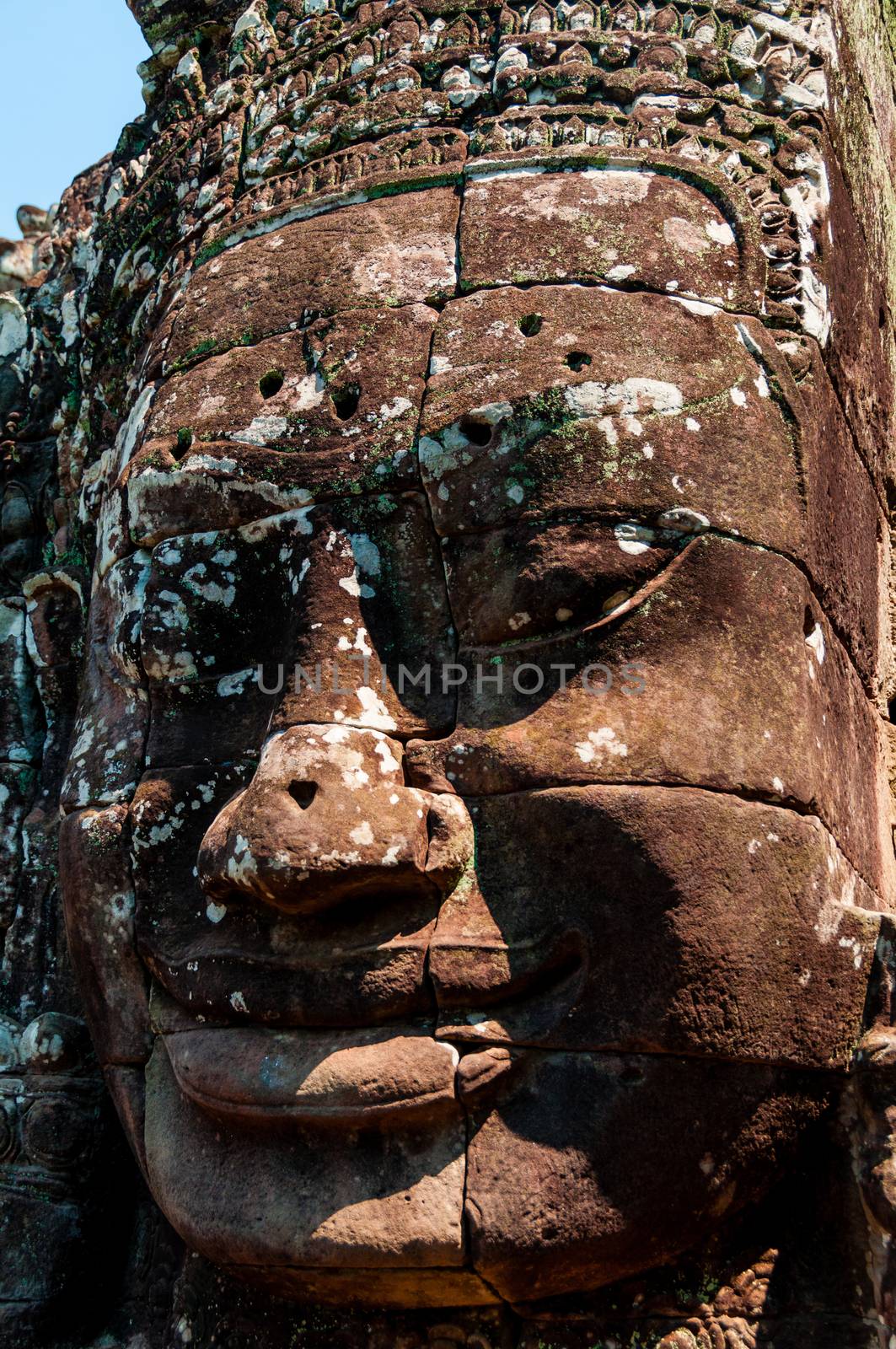 Head encarved in stone Bayon temple Angkor Wat Cambodia