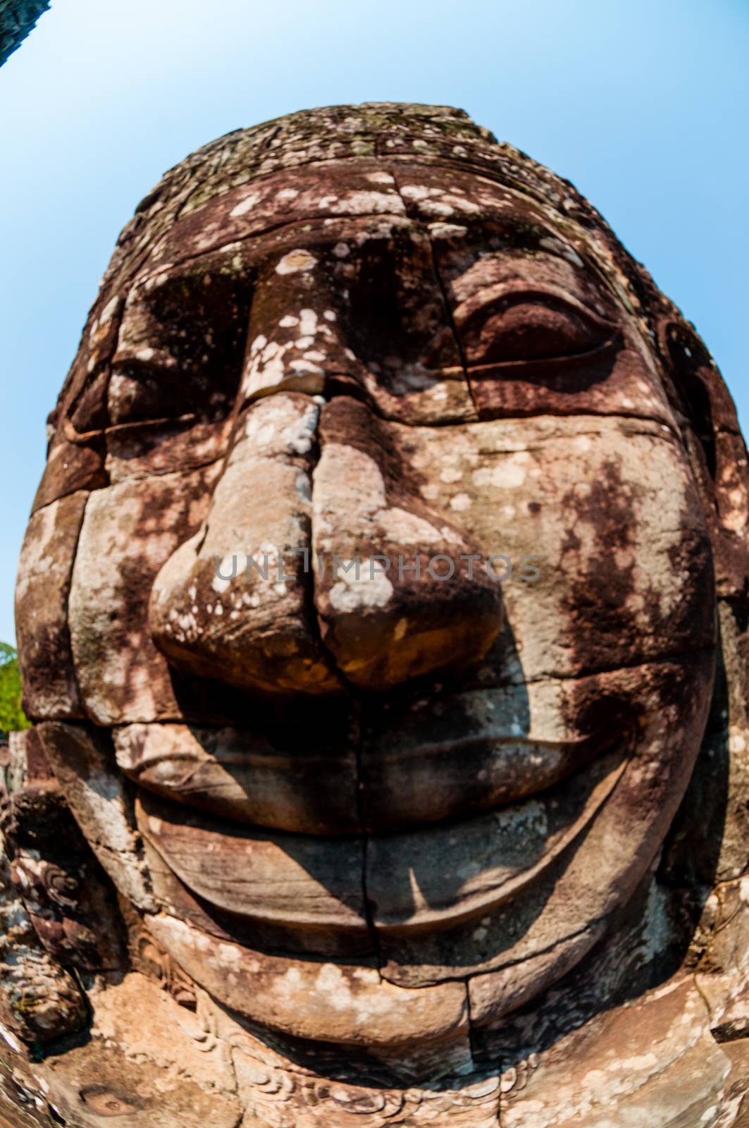 Head encarved in stone Bayon temple Angkor Wat Cambodia