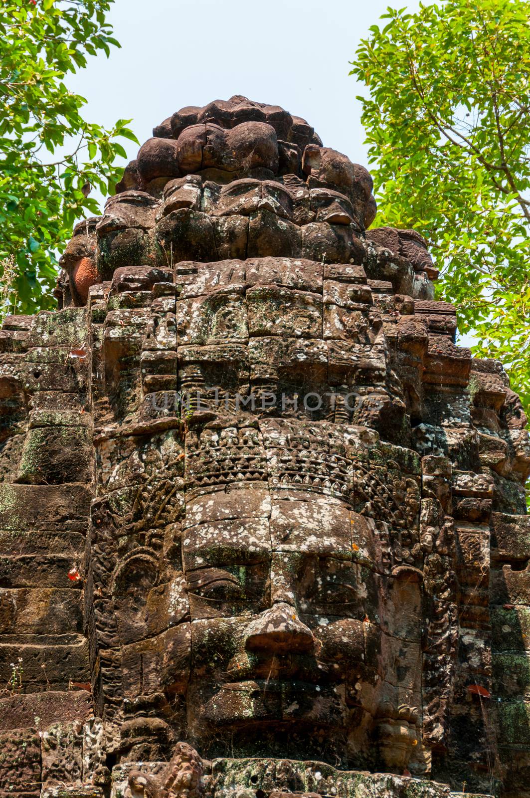 Head carved in stone Angkor Wat Cambodia