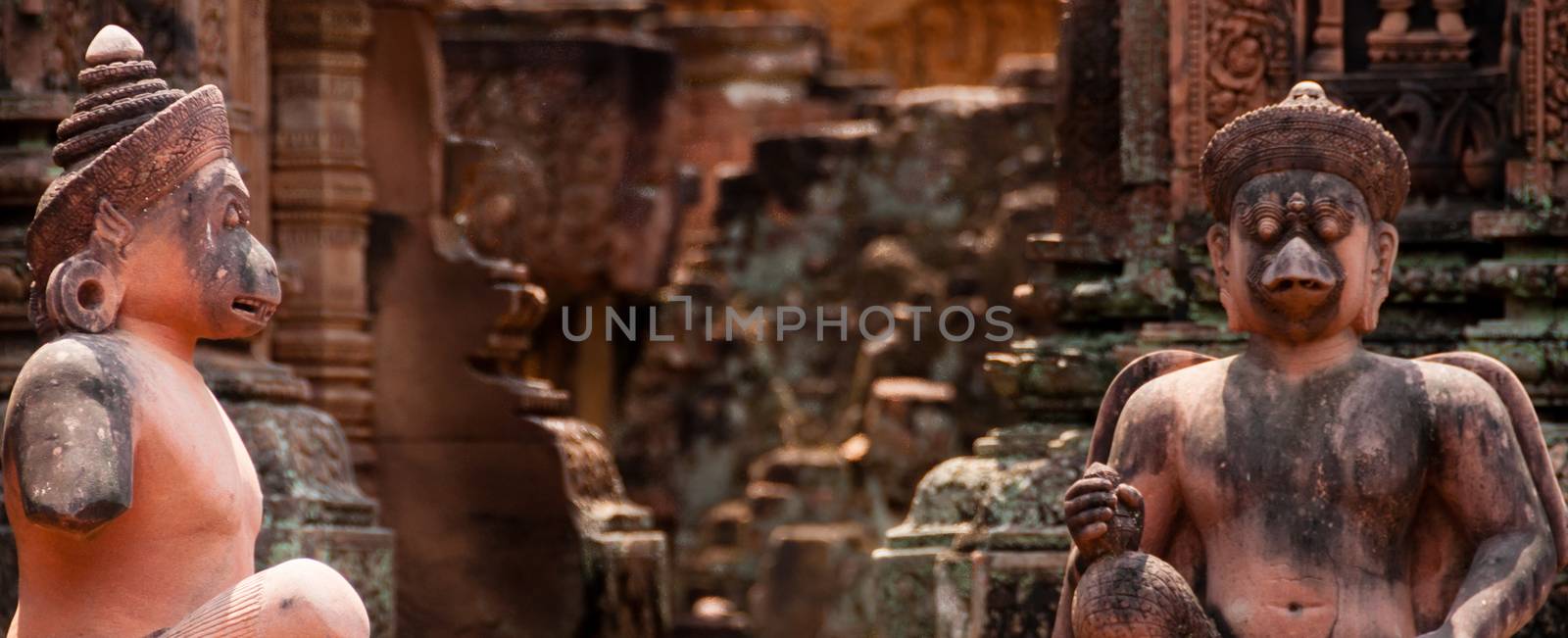 Stone sculputure sitting in front of temple Banteay Srei Angkor Wat