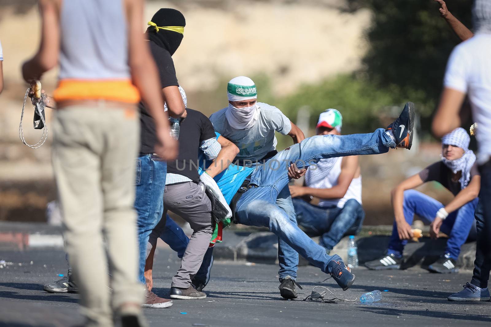 WEST BANK, Ramallah: Young masked Palestinians are seen in a street of northern Ramallah, West Bank, on October 17, 2015, during clashes with Israeli army near Beit El Israeli settlement.