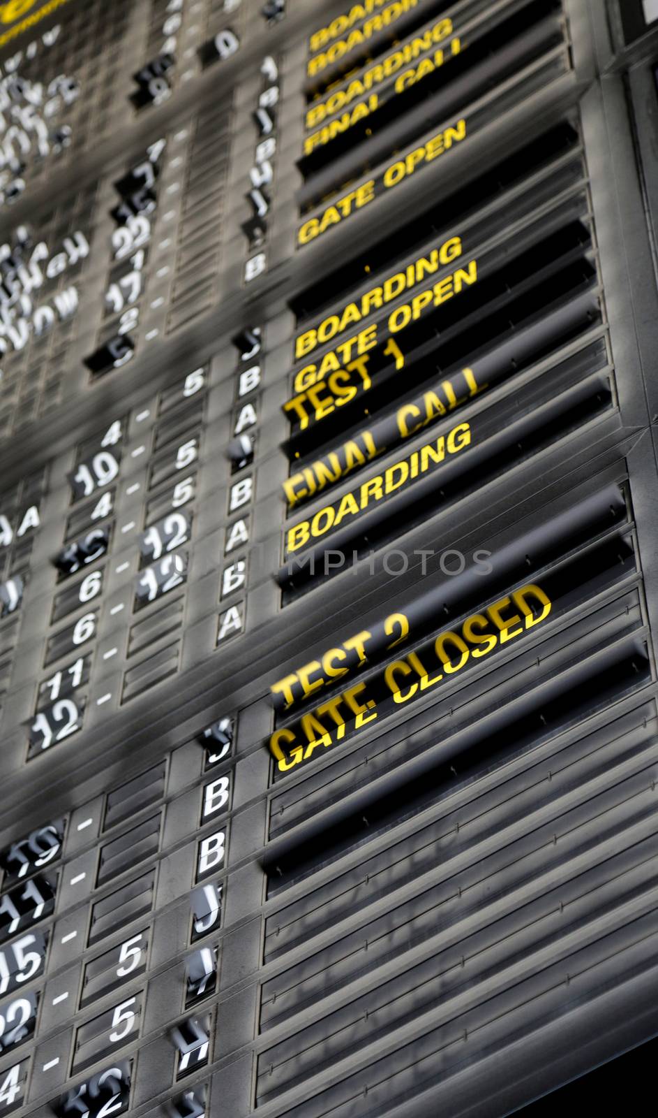 Airport departure board in terminal with flight information