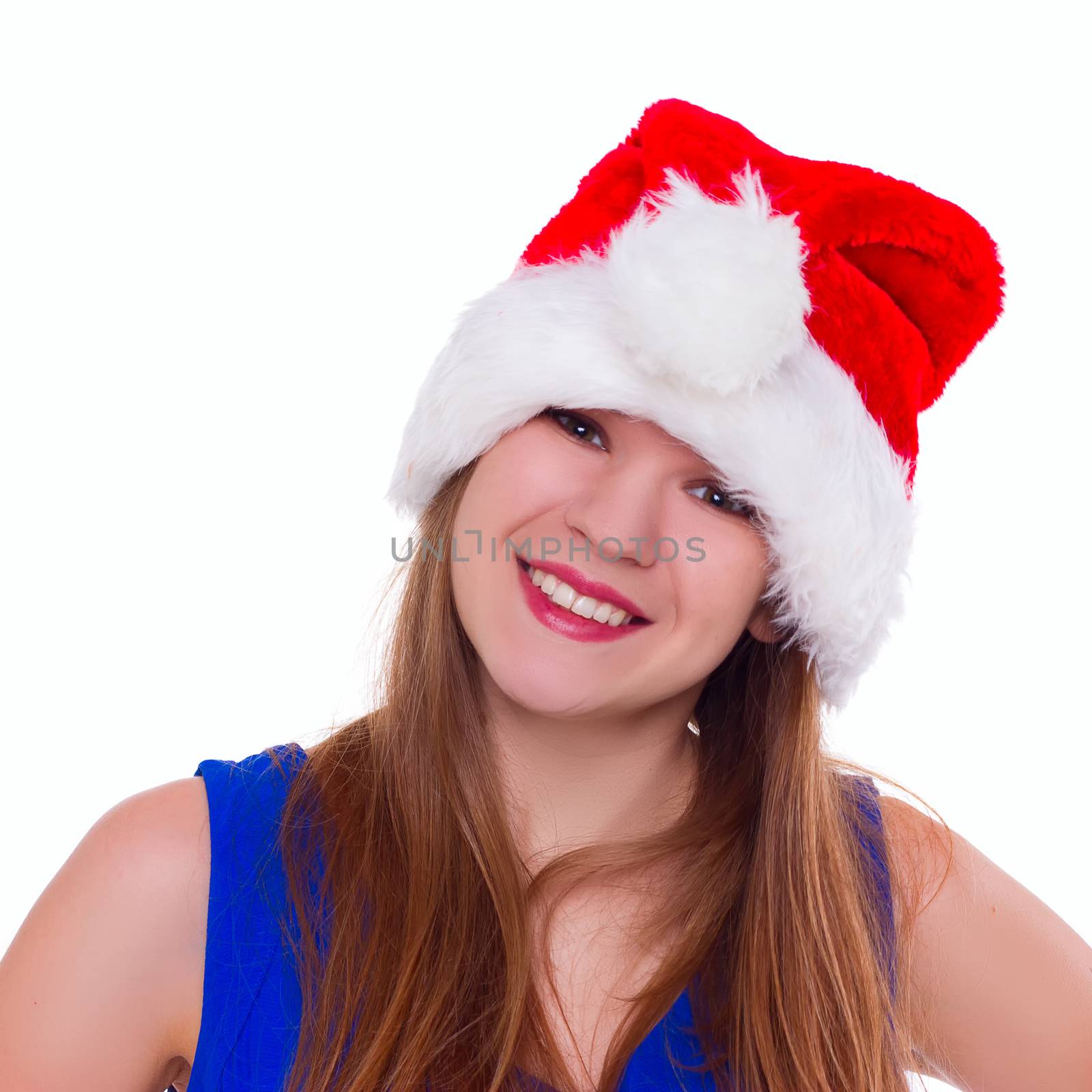 Expressive emotional girl in a Christmas hat on a white background. isolate